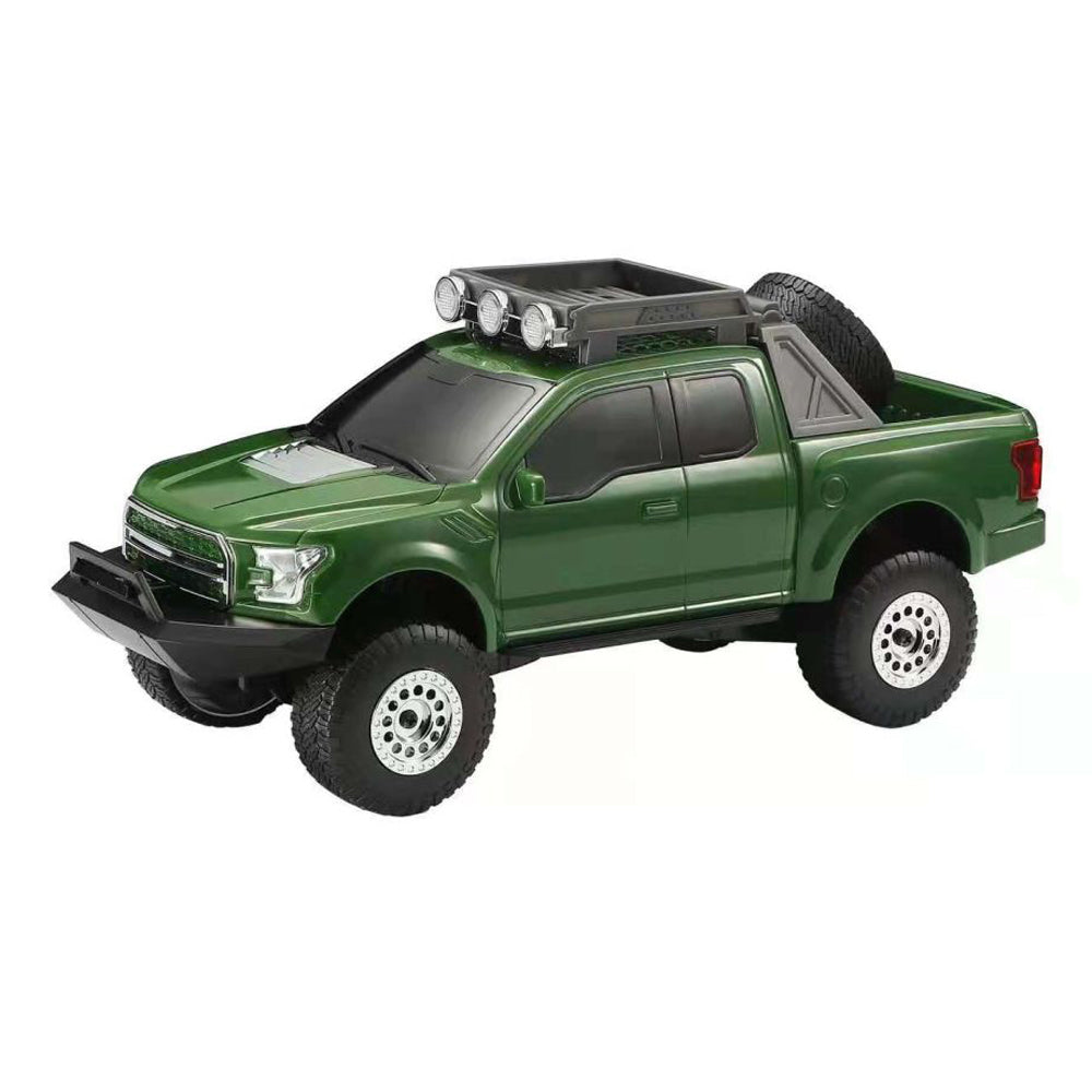 Green monster truck Bluetooth speaker with LED lights, WSTER WS-589, rugged portable wireless audio for desk setup.