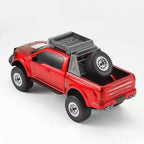Red monster truck Bluetooth speaker with LED lights, WSTER WS-589, portable wireless audio desk decor.
