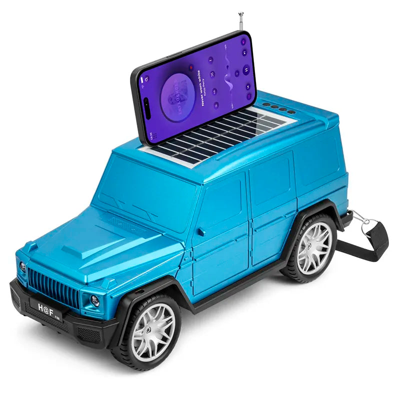 Blue luxury SUV Jeep Bluetooth speaker HF-F88 with solar charging and carry strap, portable desk setup accessory.