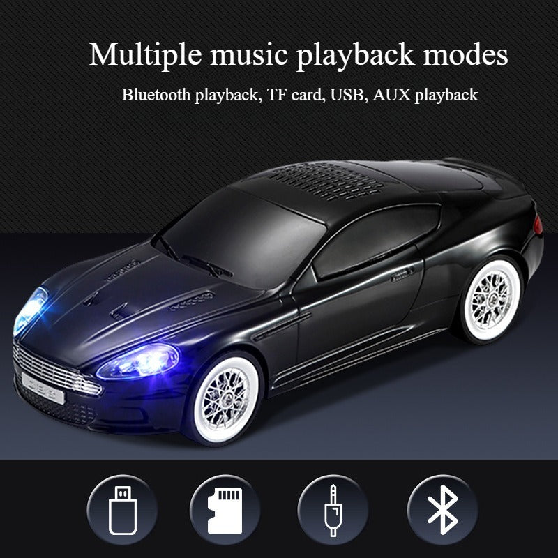 Compact modern car-style Bluetooth speaker with LED lights, WSTER WS-593, portable wireless desk setup accessory.