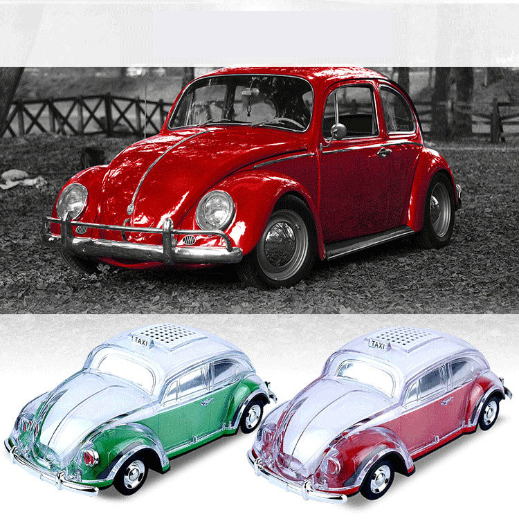 Green Beetle-style taxi car Bluetooth speaker, WSTER WS-1937, portable desk setup accessory and retro gift.