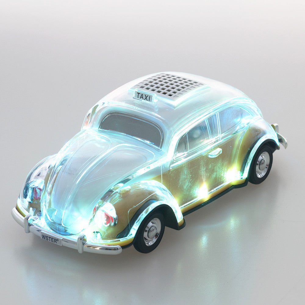 Yellow Beetle-style taxi car Bluetooth speaker, WSTER WS-1937, retro desk setup accessory and car guy gift.