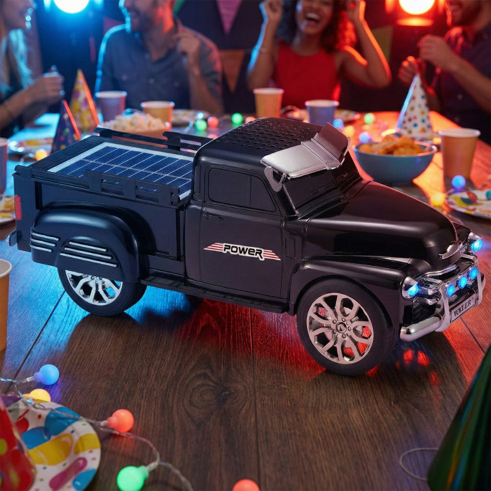 Off-road truck Bluetooth speaker with solar charging, LED headlights and moving wheels, WSTER WS-695 desk decor.