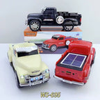 Off-road truck Bluetooth speaker with solar charging, LED headlights and moving wheels, WSTER WS-695 desk accessory.