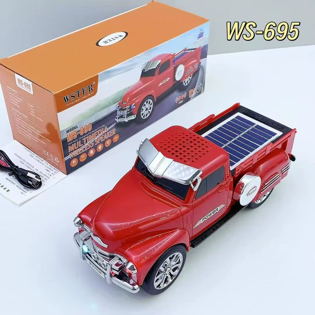 Red off-road truck Bluetooth speaker with solar charging, LED headlights and moving wheels, WSTER WS-695.