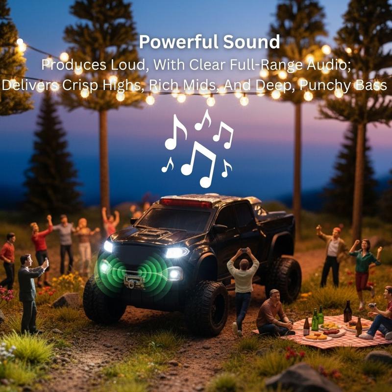 Black monster truck Bluetooth speaker with LED lights and engine sound, WSTER WS-X65, rugged desk setup decor.